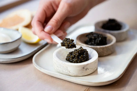 Fresh Crystal Beluga Caviar elegantly presented on a black plate